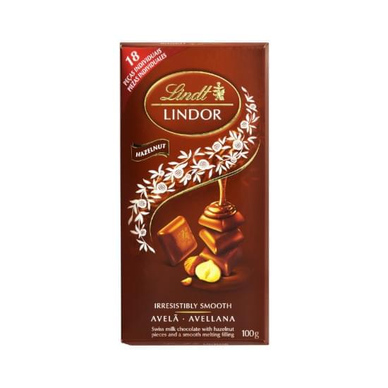 Imagem de Chocolate suíço ao leite com pedaços de avelãs recheio cremoso lindt lindor caixa 100g 12 unidades